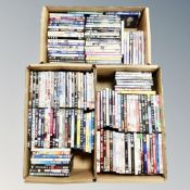 Three boxes of approximately 150 DVD's