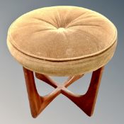 A 1970's teak G-Plan circular dressing table stool