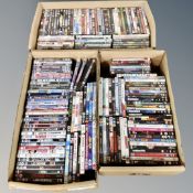 Three boxes containing approximately 150 dvds