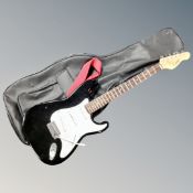 An Encore electric guitar in carry bag