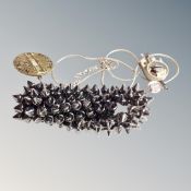 A brutalist heavily spiked polished steel bracelet,