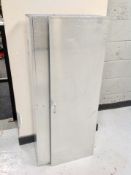 A metal storage locker 120 cm x 52 cm