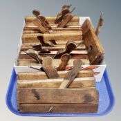 A tray of vintage wood working planes