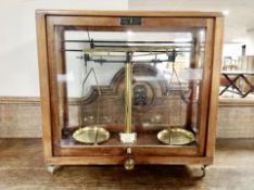 A set of chemist's scales in case by Griffon and Tatlock ltd