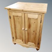 A pine double door cabinet