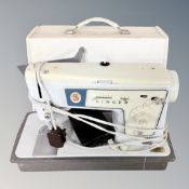 A Singer electric sewing machine with pedal