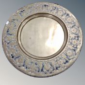 An Eastern brass embossed charger,