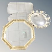 Two 1930's frameless bevelled mirrors together with a wrought metal framed mirror and further gilt