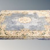 A Chinese carpet on blue ground 340 cm x 247 cm