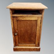 An Edwardian oak pot cupboard