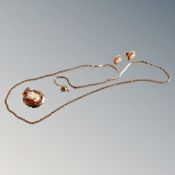 A 9ct yellow gold cameo pendant on 9ct gold chain, together with matching pair of earrings.