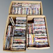 Three boxes containing approximately 150 dvds
