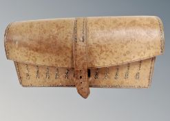 A vintage 1952 military hand machine stitched leather pouch fitted to house ammunition