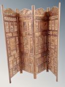 An Indonesian heavily carved four fold screen,