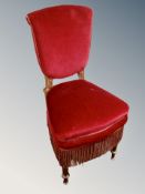 A Continental bedroom chair with tasseled upholstery CONDITION REPORT: Legs wormed.