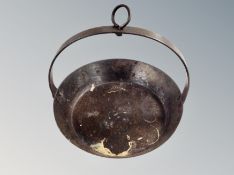 A 19th century cast iron frying pan.