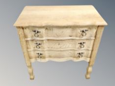 A Danish blond oak three drawer low chest,