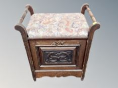 An Edwardian storage piano stool