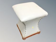 An Art Deco style shaped stool in grey leather,