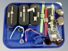 A tray of lady's and gent's fashion wrist watches including Guess,