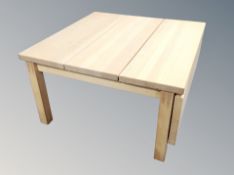 A beech effect drop leaf coffee table