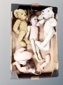 A box containing porcelain headed doll, further doll parts including porcelain head stamped Germany,