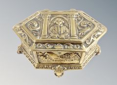 A cast brass lozenge shaped ring box depicting William Shakespeare,