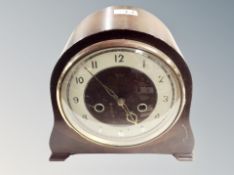 An oak cased mantel clock.