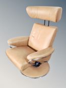 A Stressless chrome and tan leather upholstered swivel armchair