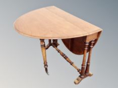 A walnut drop leaf table