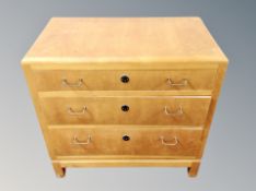 A Danish maple veneered three drawer low chest,