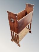 An Edwardian oak magazine rack,