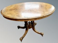 A Victorian inlaid walnut oval pedestal breakfast table
