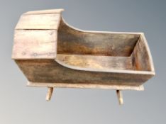 An antique dolls crib.