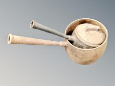 Two antique cast iron long handled cooking pots,