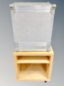 An Ikea occasional table together with a metal flight case