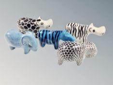 Five polished stone animal figures, height 6 cm.