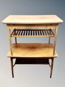 Two Scandinavian walnut veneered rectangular coffee tables with under shelves