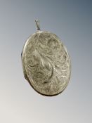 An engraved silver locket,