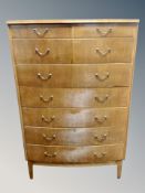 A Scandinavian teak seven drawer bow fronted chest,