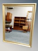 A gilt framed bevelled overmantel mirror
