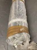 A roll of contemporary black and silvered fabric