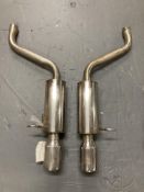 A pair of polished steel exhausts.