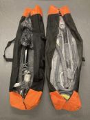 Two drywall electric strata sanders in carry bags.