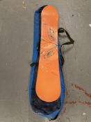 A Burton fibreglass snow board in bag