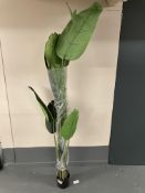 An artificial palm in pot.