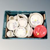 A box of Poole Springtime dinner ware and a plastic storage jar