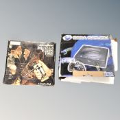 A boxed Sega Saturn games console,