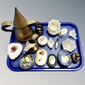 A tray of glass paperweights, trinket boxes, brass bell,