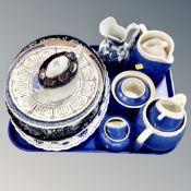 A tray of assorted collector's plates and serving platters,